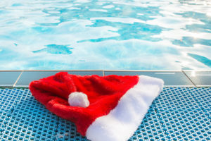 Christmas hat by the swimmingpool on a sunny day